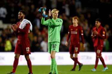 Caoimhin Kelleher and Joe Gomez applaud the fans after defeating MK Dons in the Carabao Cup